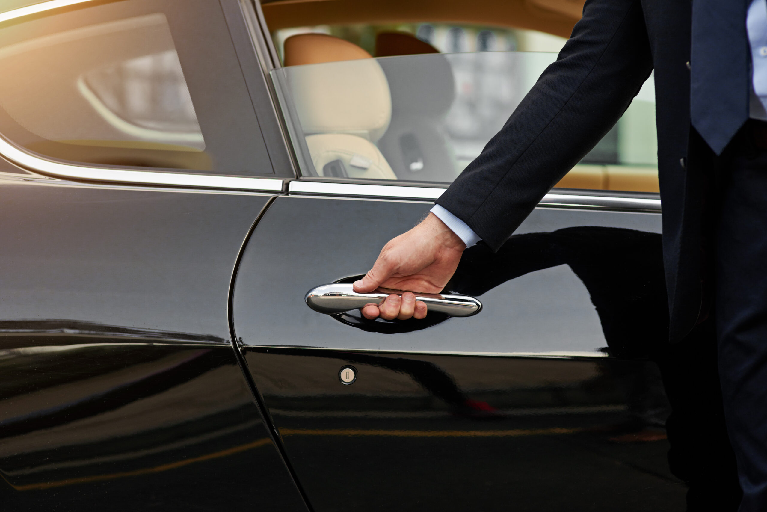 Businessman, hands and chauffeur by car door for travel accommodation, designated driver or commute. Hand of male person on vehicle handle in professional transport service, business class or pick up.