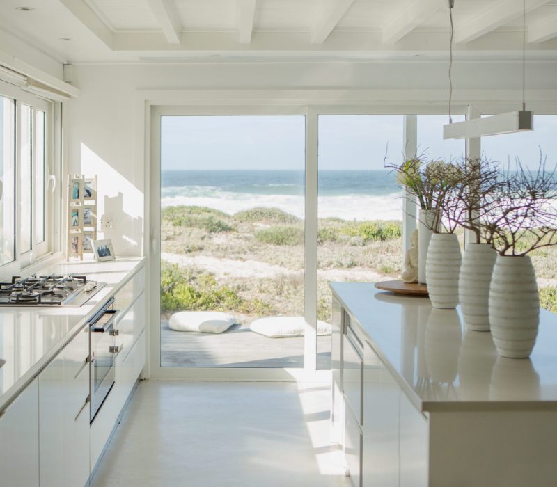 Modern white kitchen with ocean view